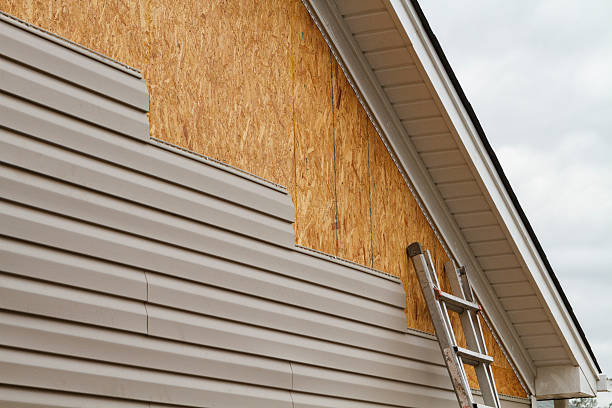 Professional Storm Damage Siding Repair technician working in Berlin, OH